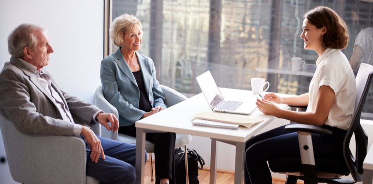 Accountant with clients. Accountant with clients.