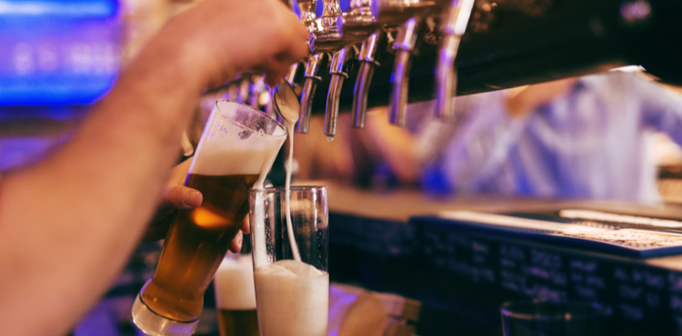 Bartender pouring a draft beer. Bartender pouring a draft beer.