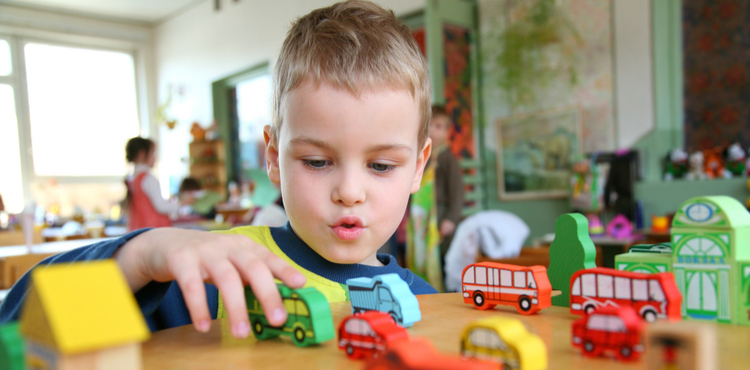 Young boy playing with toys. Young boy playing with toys.