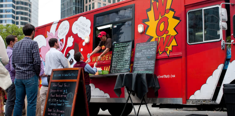 Customers at a food truck. Customers at a food truck.