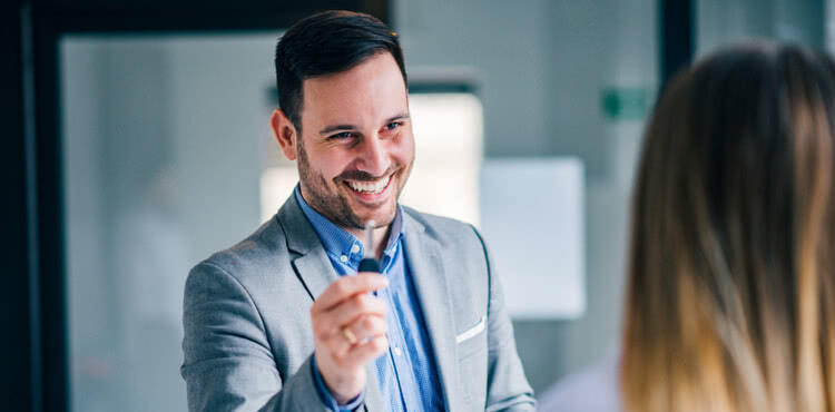 Businessman giving an office key to a woman. Businessman giving an office key to a woman.