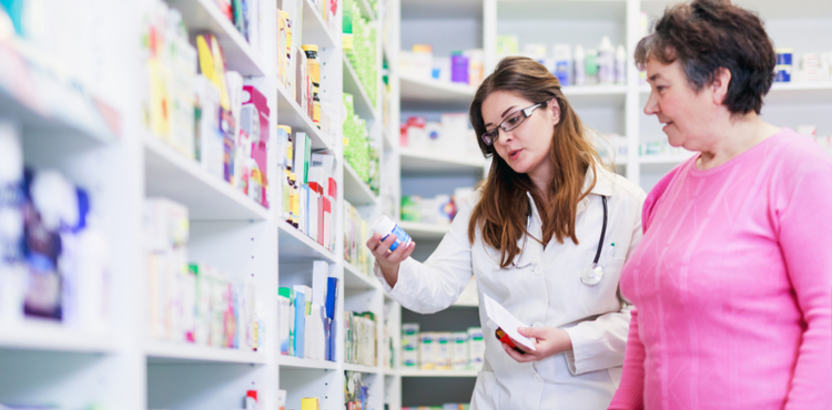 Pharmacist helping patient. Pharmacist helping patient.