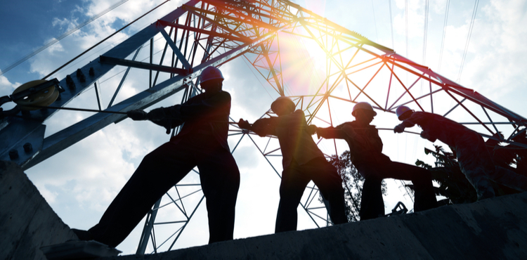 Silhouette of construction workers on a job site. Silhouette of construction workers on a job site.