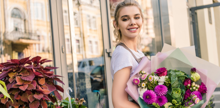 Woman purchasing roses from a florist. Woman purchasing roses from a florist.