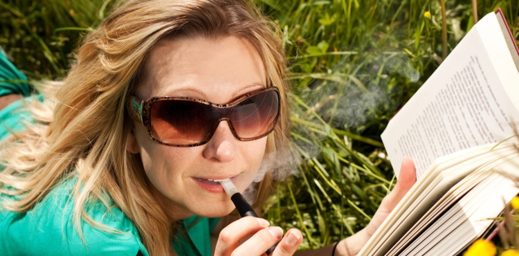 Woman smoke e-cigarette. Woman smoke e-cigarette.