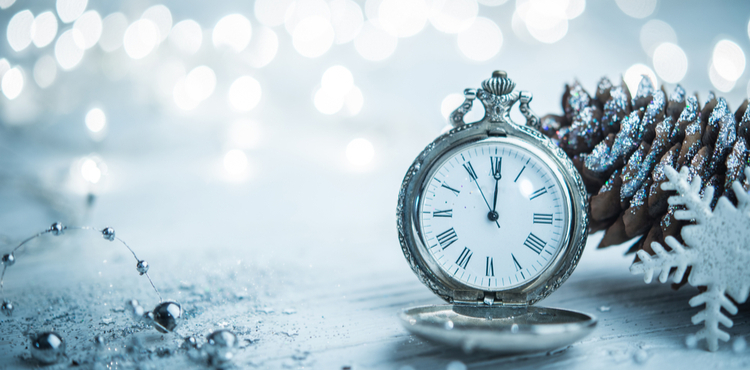 An alarm clock next to a pinecone and snowflake. An alarm clock next to a pinecone and snowflake.