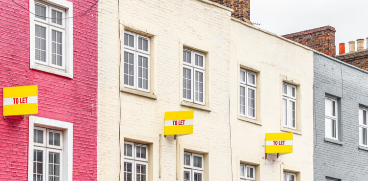 Colorful houses in a row with 'for let' signs. Colorful houses in a row with 'for let' signs.