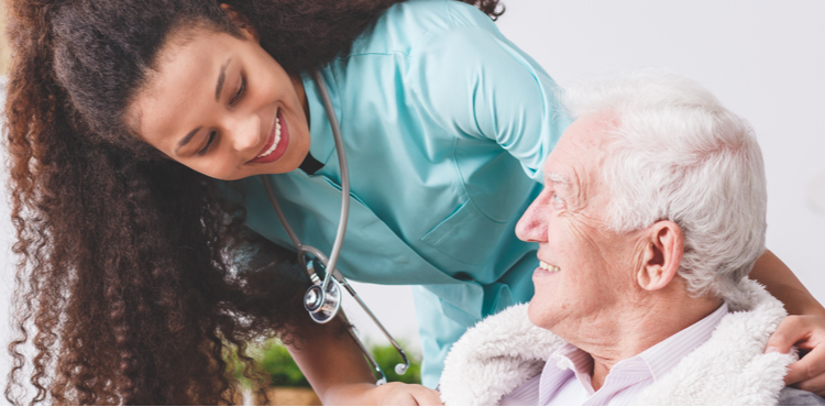 A female nurse caring for an elderly patient. A female nurse caring for an elderly patient.