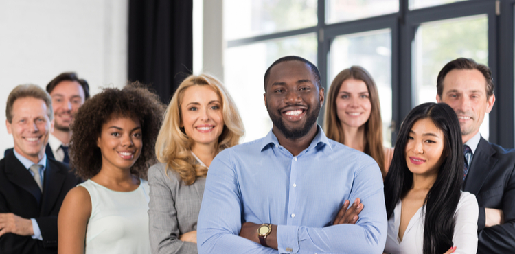 Group of employees smiling at the camera. Group of employees smiling at the camera.