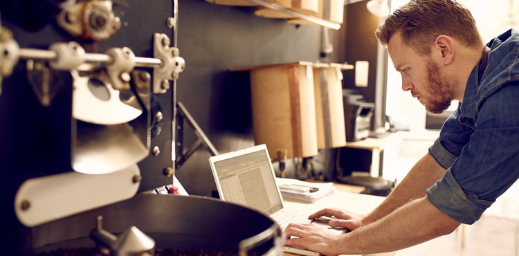 Man in work environment working on laptop. Man in work environment working on laptop.