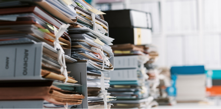 A pile of files and papers. A pile of files and papers.