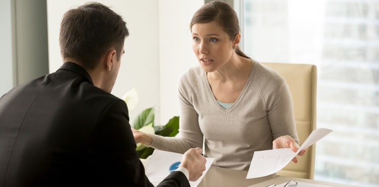 Upset employee complaining to boss. Upset employee complaining to boss.