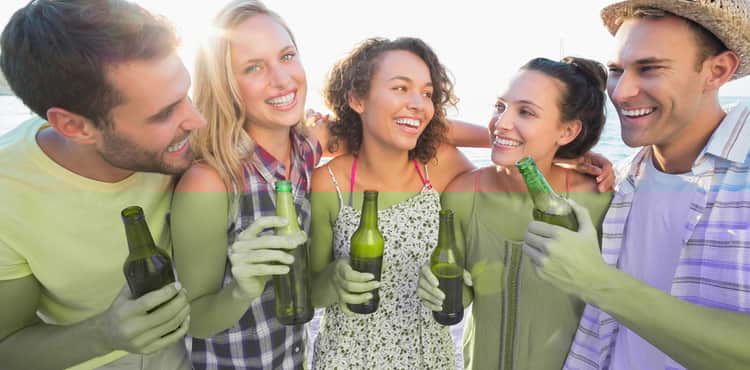 Friends have a beer together. Friends have a beer together.