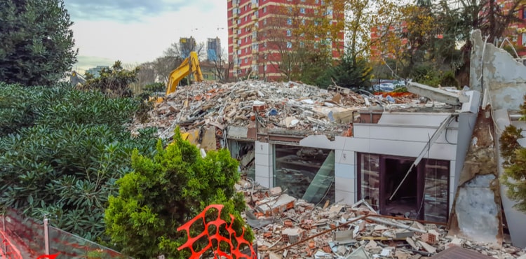 Building covered in rubble from a demolition. Building covered in rubble from a demolition.