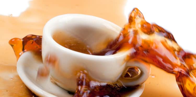 Cup of coffee spilling out. Cup of coffee spilling out.