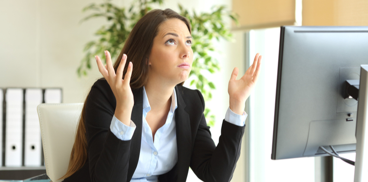 Frustrated woman sits at her computer. Frustrated woman sits at her computer.