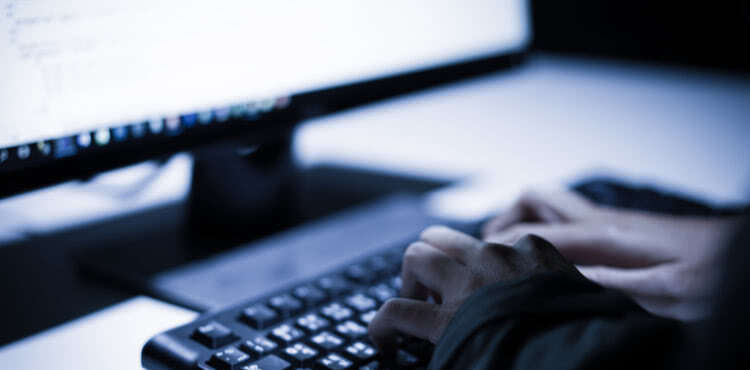 Ominous person working at computer. Ominous person working at computer.