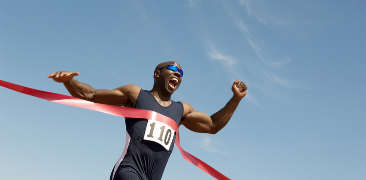 Man happily crossing the finish line. Man happily crossing the finish line.