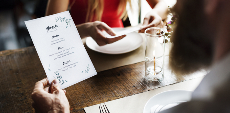 Man looking at menu in restaurant. Man looking at menu in restaurant.