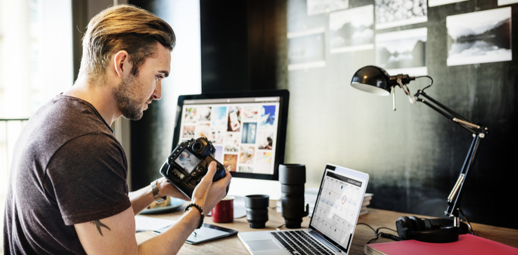 Photographer working in office. Photographer working in office.