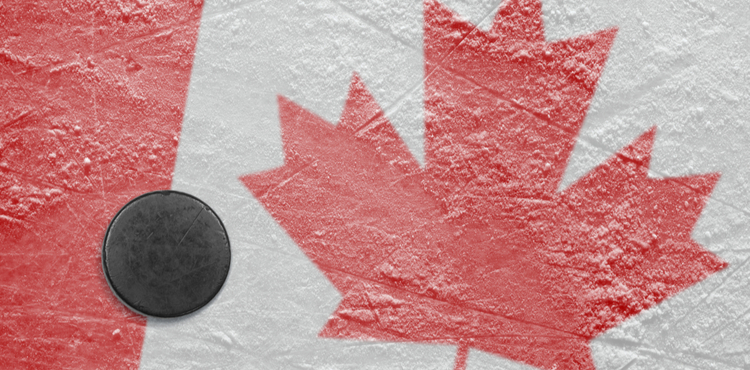 A hockey puck sits on a Canadian ice rink. A hockey puck sits on a Canadian ice rink.
