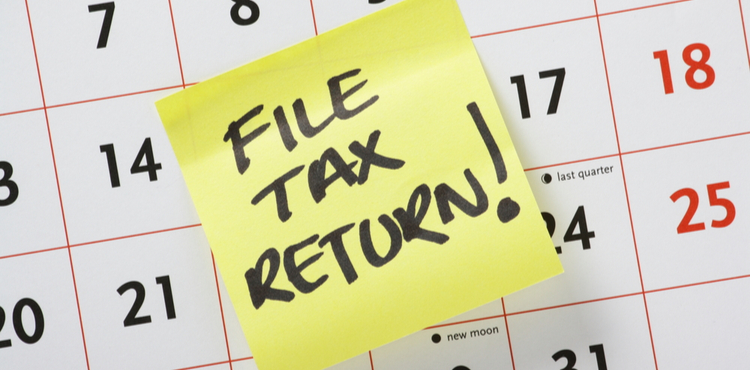 Post it reminder on calendar to file a tax return. Post it reminder on calendar to file a tax return.