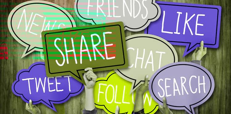 People hold up social media speech bubbles. People hold up social media speech bubbles.