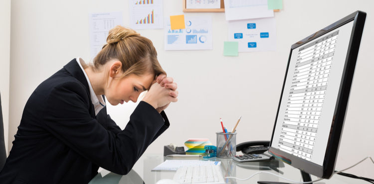 Stressed out woman sitting at her desk. Stressed out woman sitting at her desk.