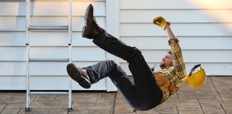 A construction worker falling off a ladder. A construction worker falling off a ladder.