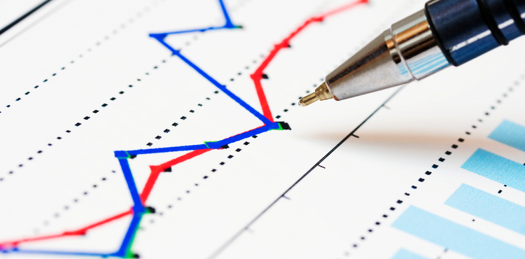 A closeup of graphs and a pen. A closeup of graphs and a pen.