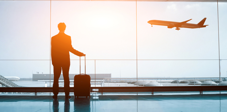 A man in a suit waits at the airport. A man in a suit waits at the airport.