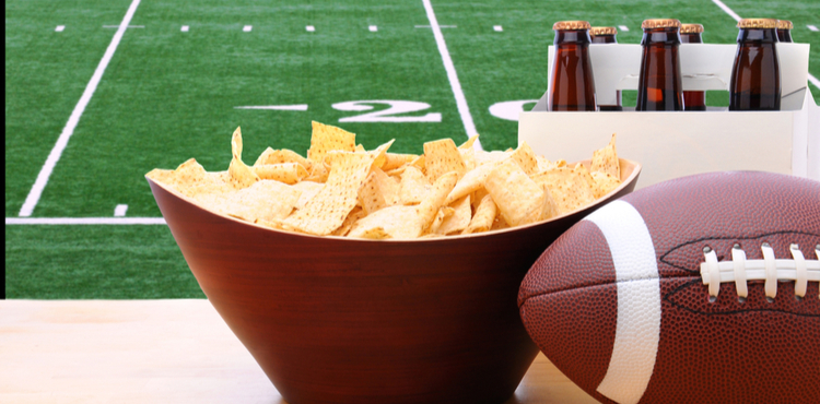 Bowl of chips and a six pack of beer, ready for a football party. Bowl of chips and a six pack of beer, ready for a football party.