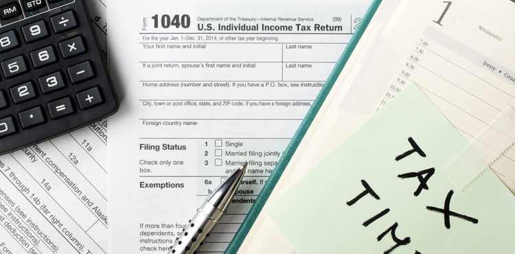 Getting ready for tax time with 1040 and calculator. Getting ready for tax time with 1040 and calculator.