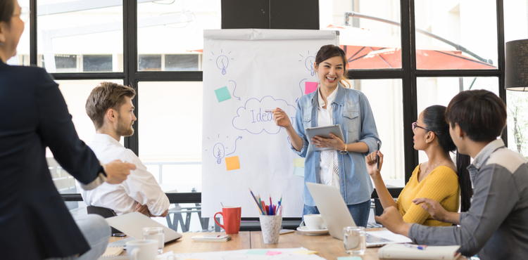 A woman presents a new idea at a casual business meeting. A woman presents a new idea at a casual business meeting.
