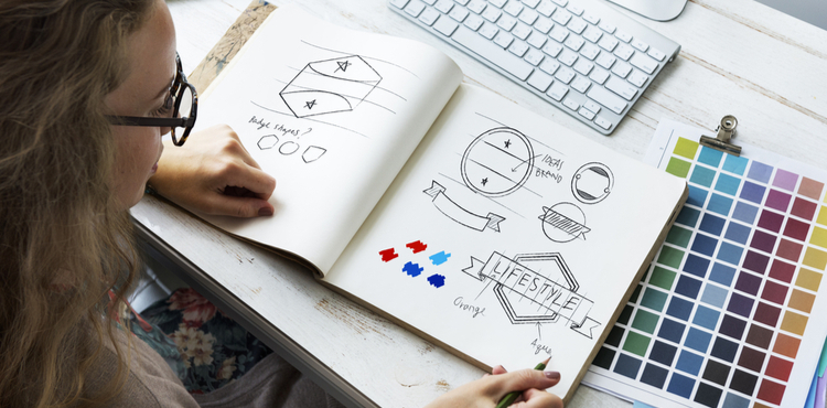 Graphic designer with sketches. Graphic designer with sketches.
