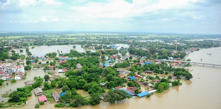 Aerial photo of a city flooded by an adjacent river.