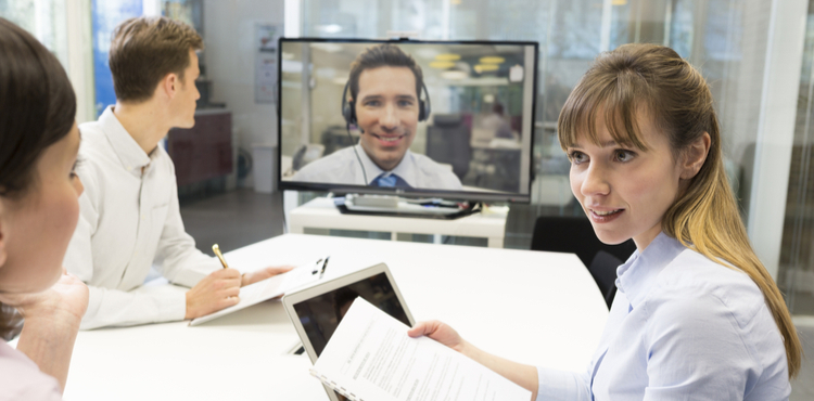 Team meeting with remote employee. Team meeting with remote employee.