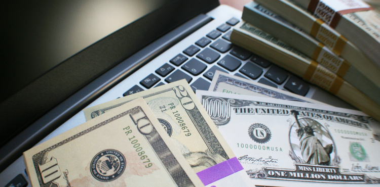 Money on a laptop. Money on a laptop.