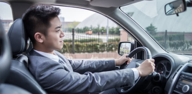 Man in a sport coat driving Man in a sport coat driving