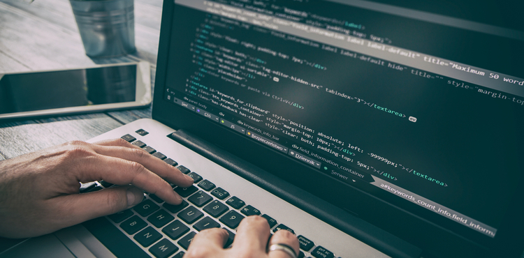 Computer code on a laptop. Computer code on a laptop.