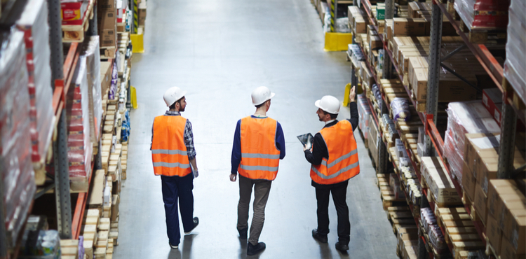 Three warehouse workers Three warehouse workers