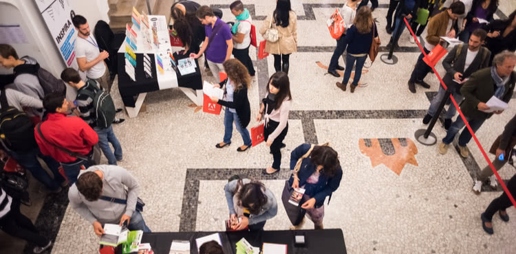 Vendors and guests at a business expo. Vendors and guests at a business expo.
