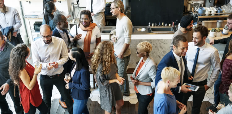 Group of businesspeople at a networking event. Group of businesspeople at a networking event.