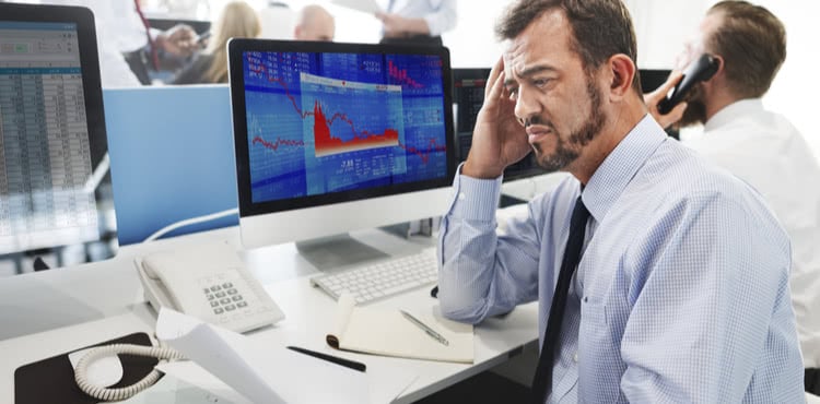 Stressed-out businessman in front of computer
