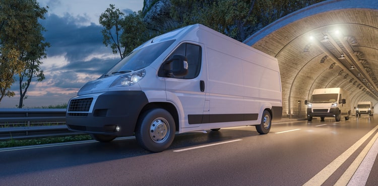 Commercial vehicle driving down road Commercial vehicle driving down road