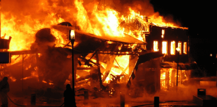 Commercial building engulfed in flames.