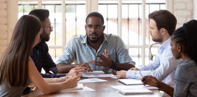 Business people planning a data breach response. Business people planning a data breach response.