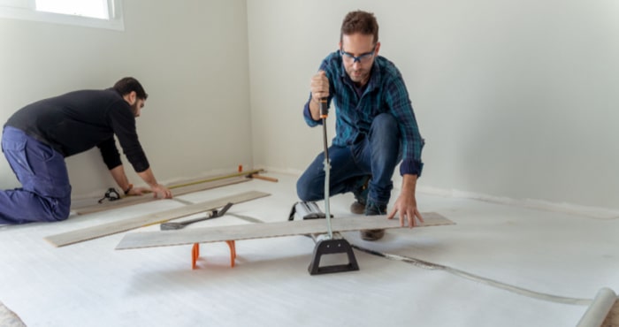 Two handymen working on a room Two handymen working on a room