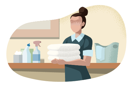 Woman holding towels next to cleaning supplies.
