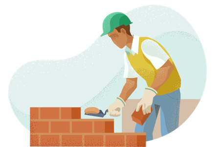 Man in helmet laying bricks.